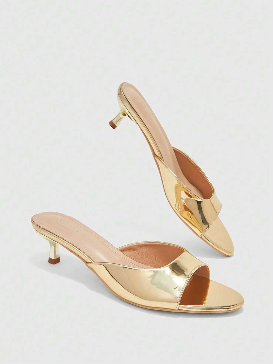 Pair of women's open toe high heel slingback sandals made with smooth PU leather