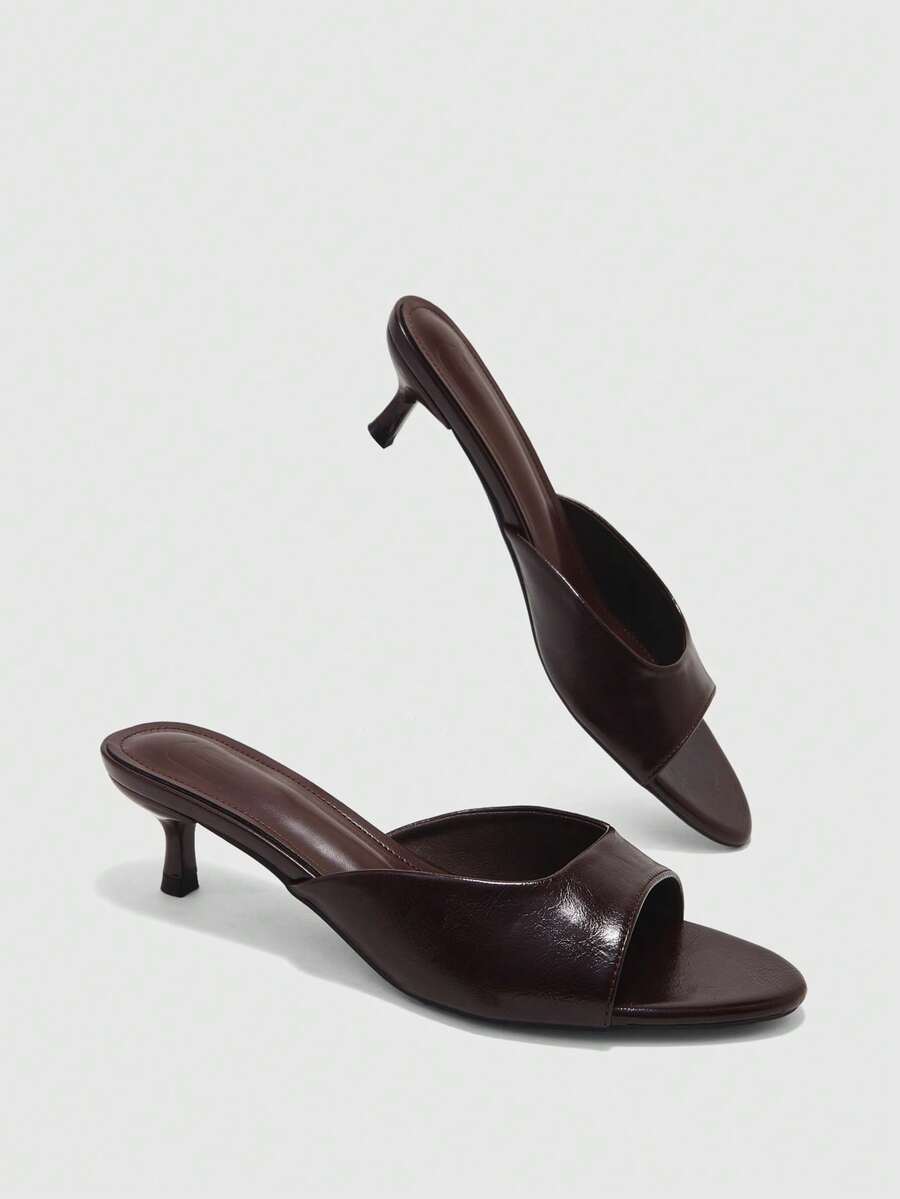 Pair of women's open toe high heel slingback sandals made with smooth PU leather