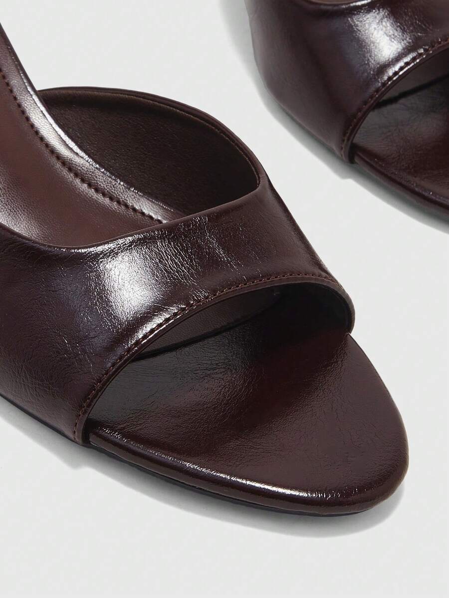 Pair of women's open toe high heel slingback sandals made with smooth PU leather