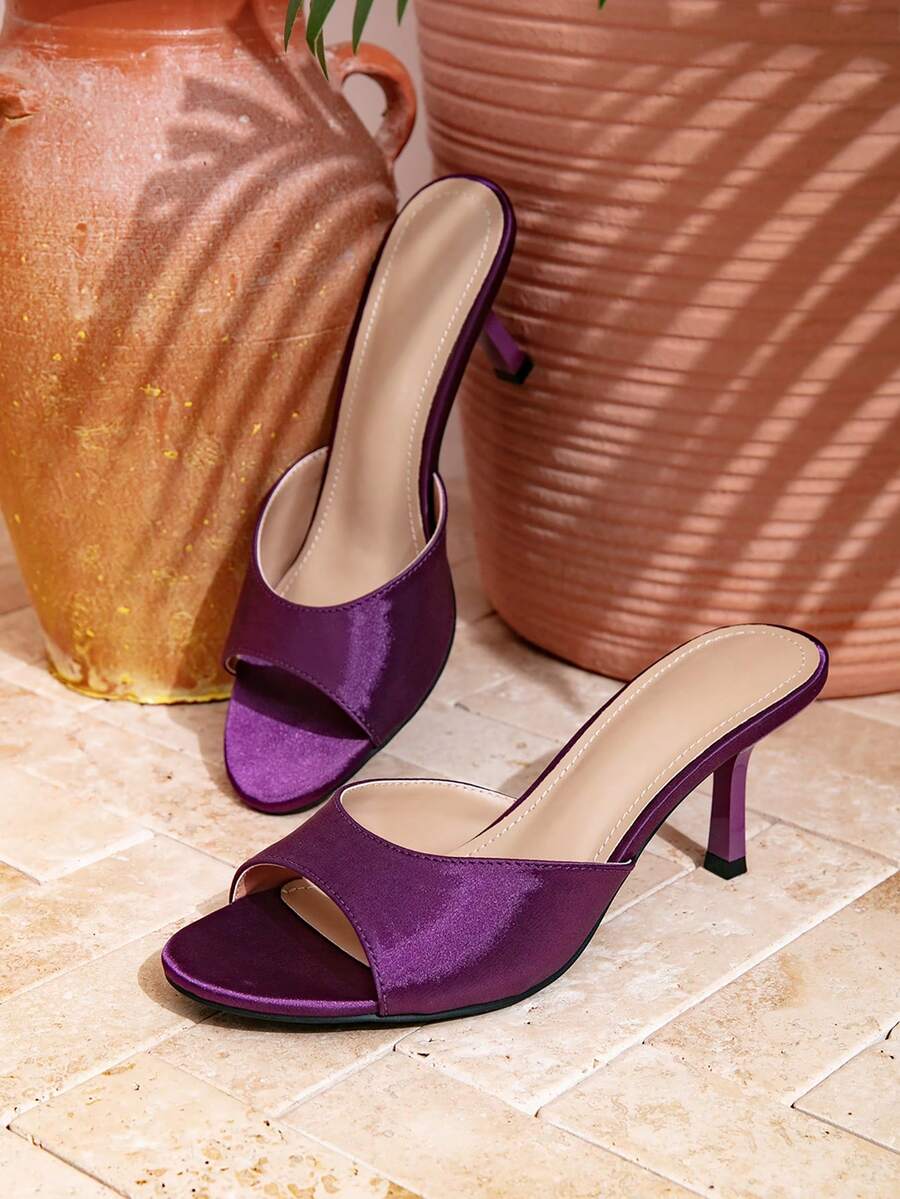 Elegant women's black stiletto heel sandals with open toe slingback design and PU leather upper.