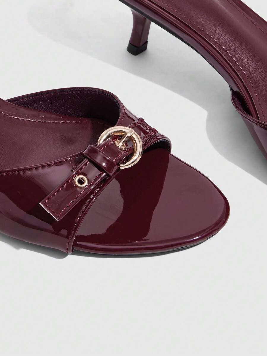 Women's light gold kitten heel slingback sandals featuring an open toe and round buckle strap.
