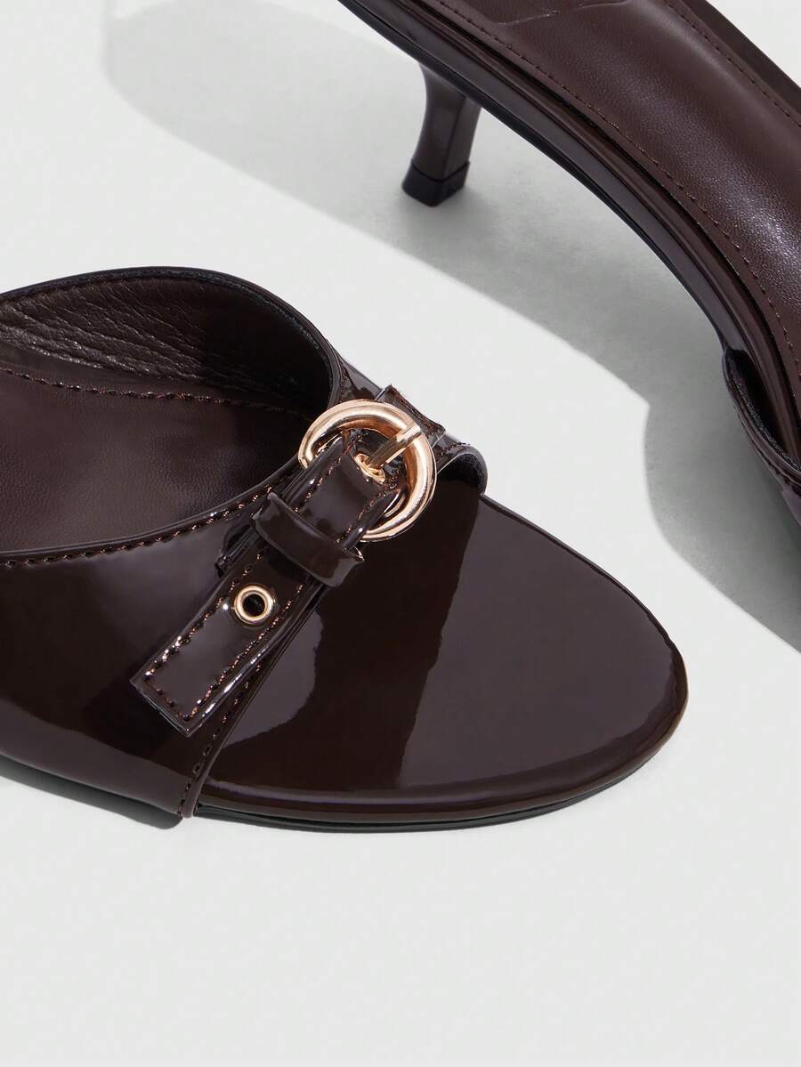 Women's light gold kitten heel slingback sandals featuring an open toe and round buckle strap.