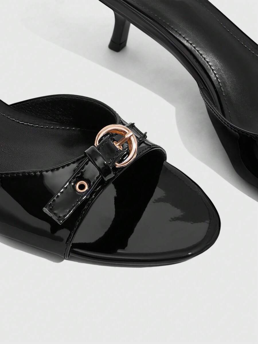 Women's light gold kitten heel slingback sandals featuring an open toe and round buckle strap.