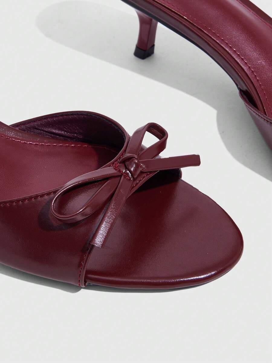 Burgundy high heel sandals for women featuring an open toe, decorative bow, 5.5cm kitten heel, and slingback strap.