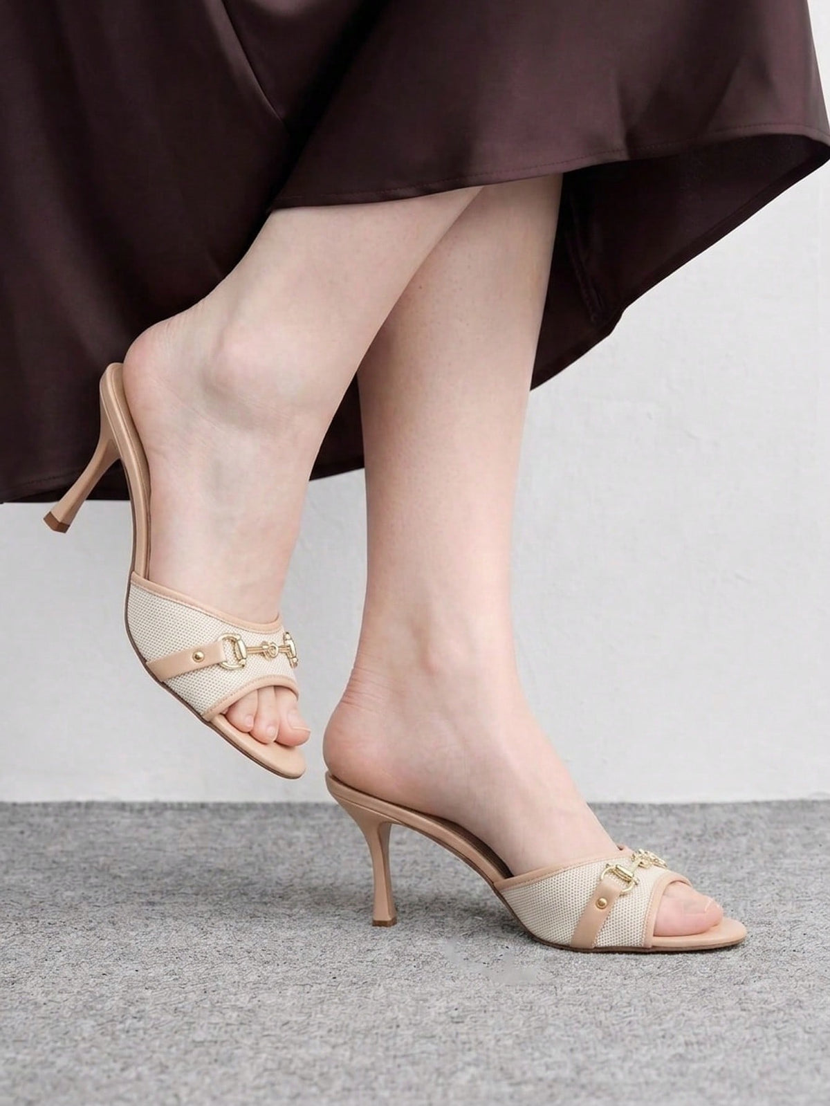 Women's beige high heel mule sandals with open round toe and metal chain detail