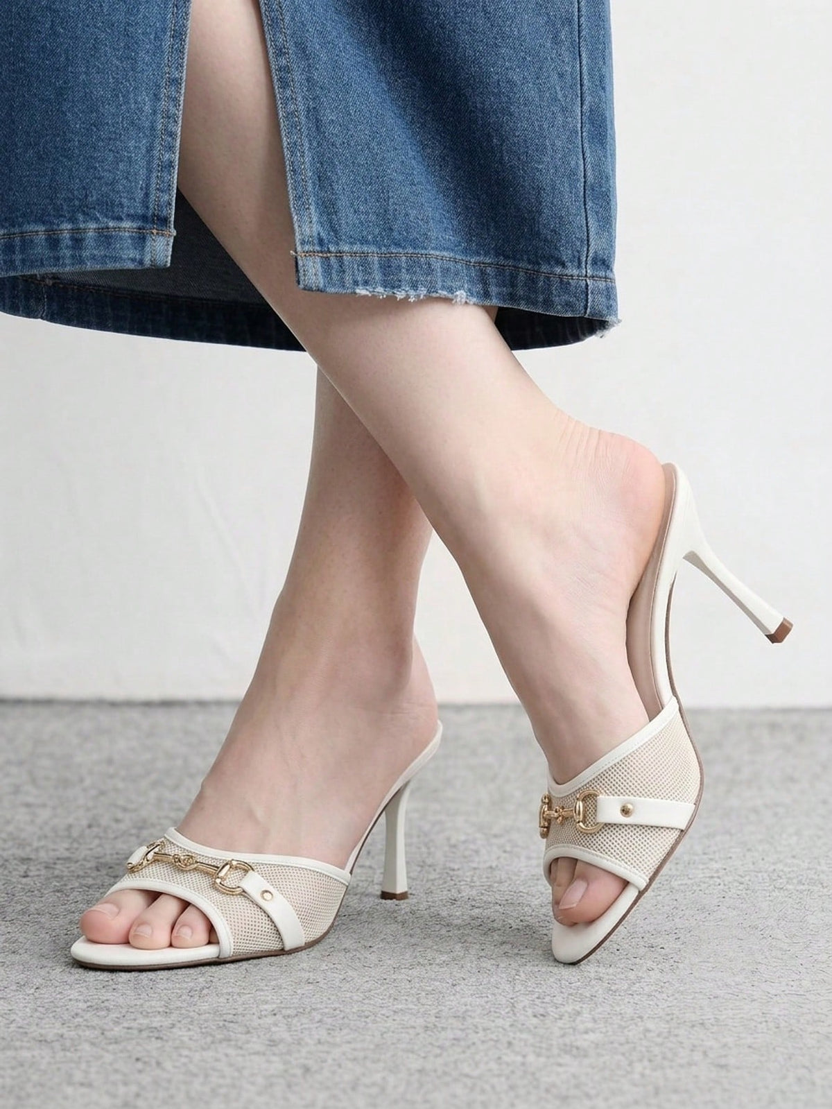 Women's beige high heel mule sandals with open round toe and metal chain detail