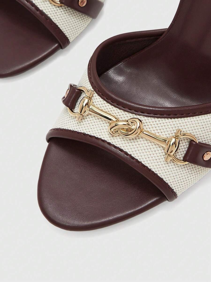 Women's beige high heel mule sandals with open round toe and metal chain detail