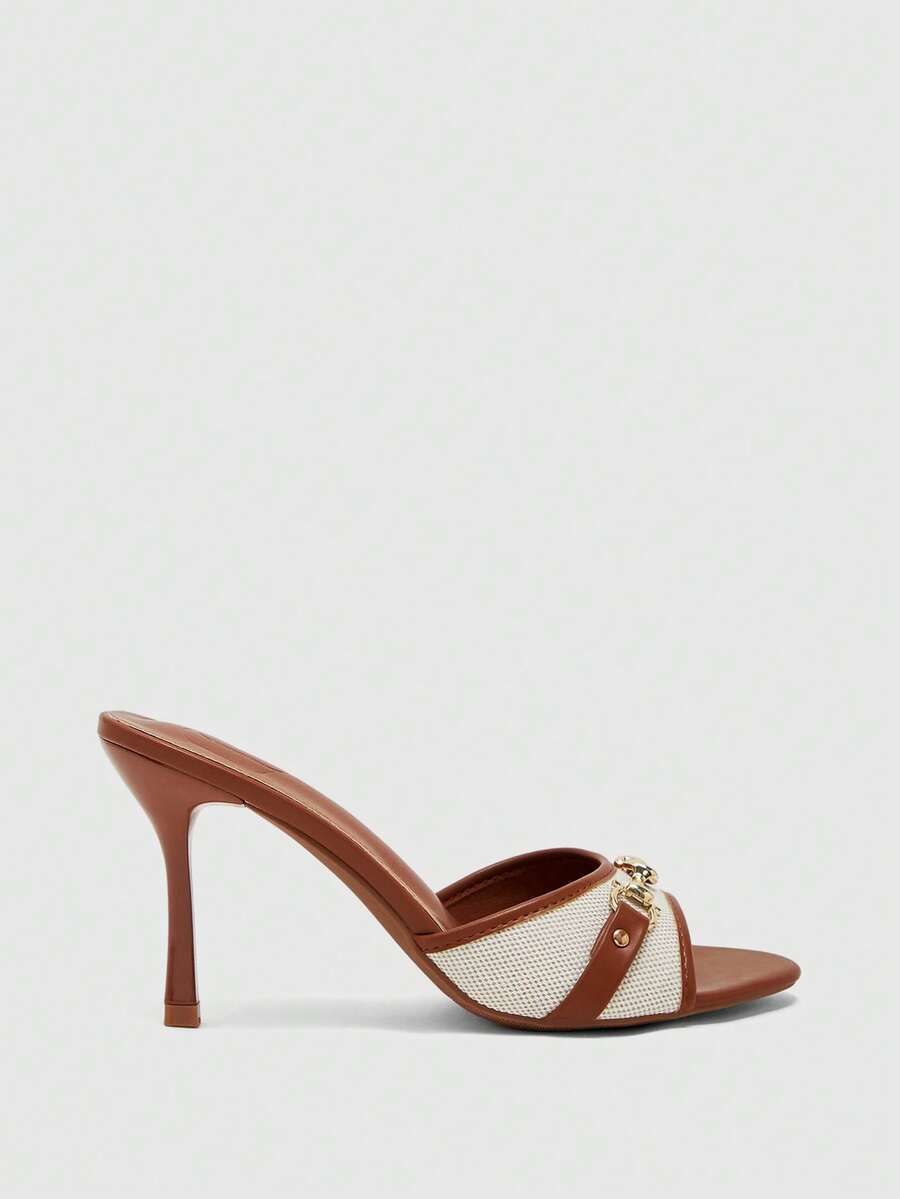 Women's beige high heel mule sandals with open round toe and metal chain detail