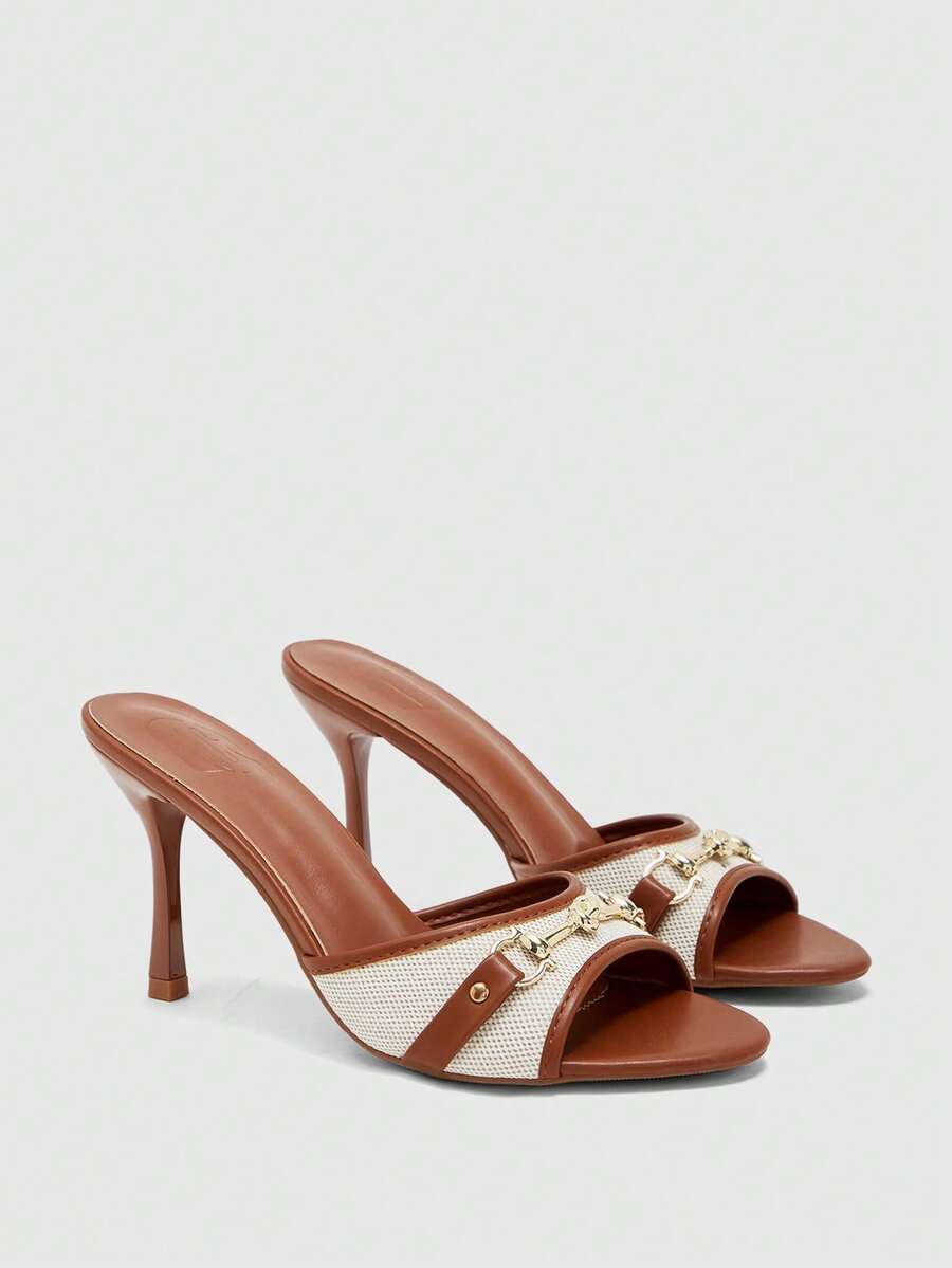 Women's beige high heel mule sandals with open round toe and metal chain detail