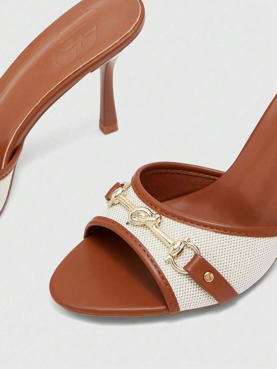 Women's beige high heel mule sandals with open round toe and metal chain detail