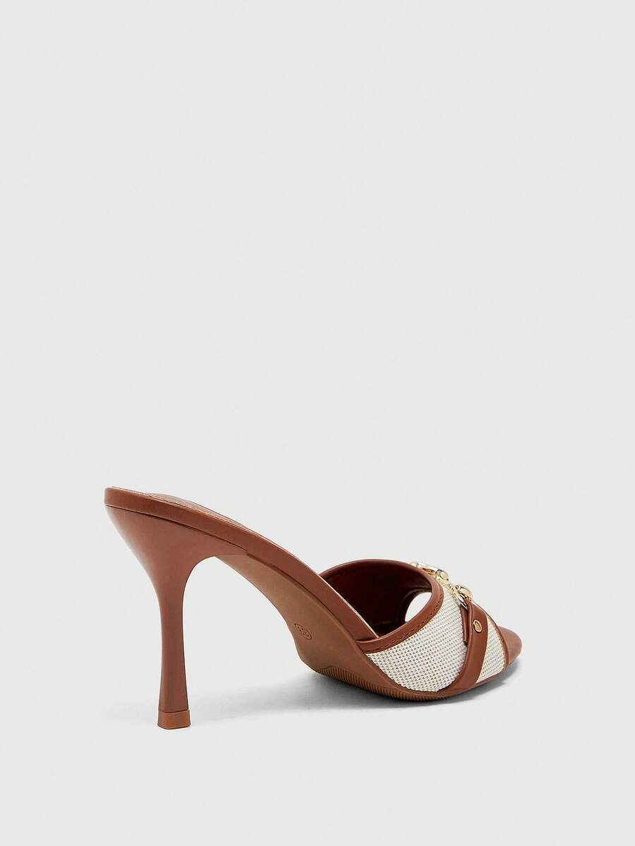 Women's beige high heel mule sandals with open round toe and metal chain detail