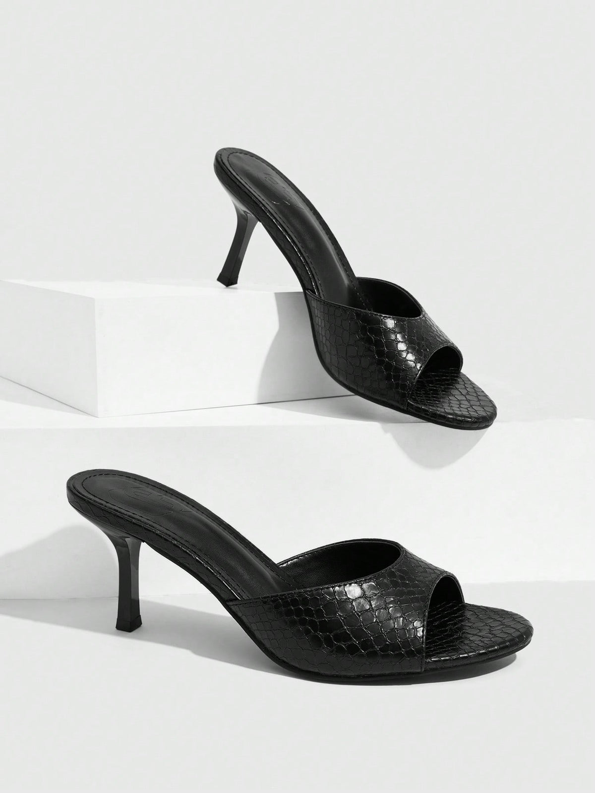 Pair of women's open toe high heel slingback sandals made with smooth PU leather