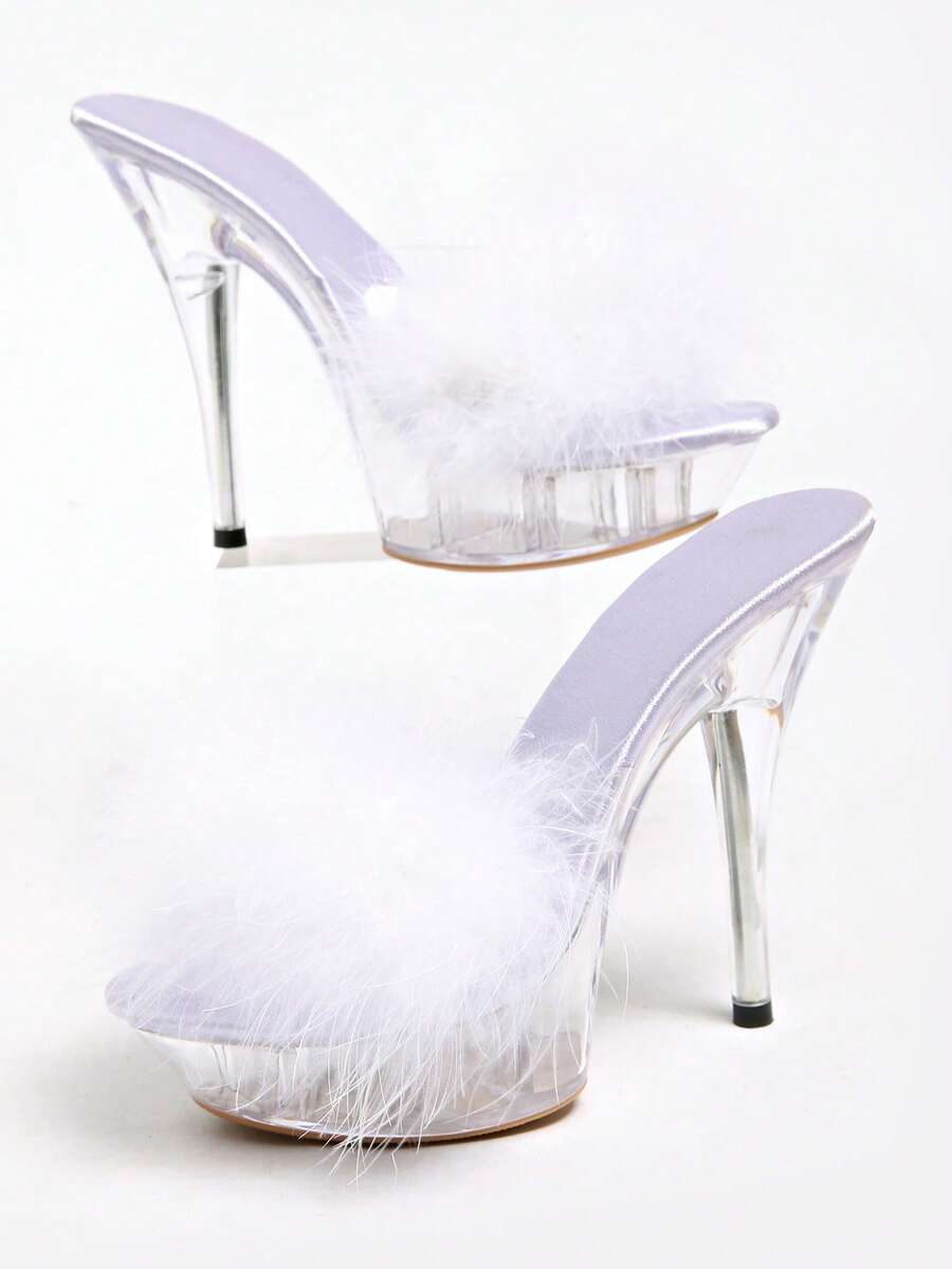Transparent chunky heel platform slide sandals for women featuring clear PVC upper, open toe design, and ultra high heels.