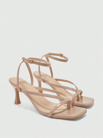 Burgundy women's thin strap thong sandals with ankle strap and kitten heels.