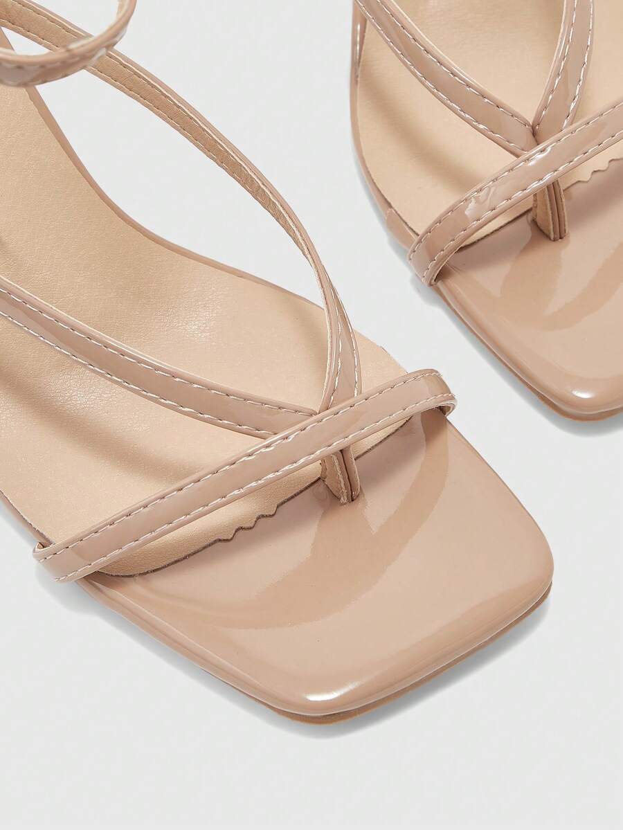 Burgundy women's thin strap thong sandals with ankle strap and kitten heels.