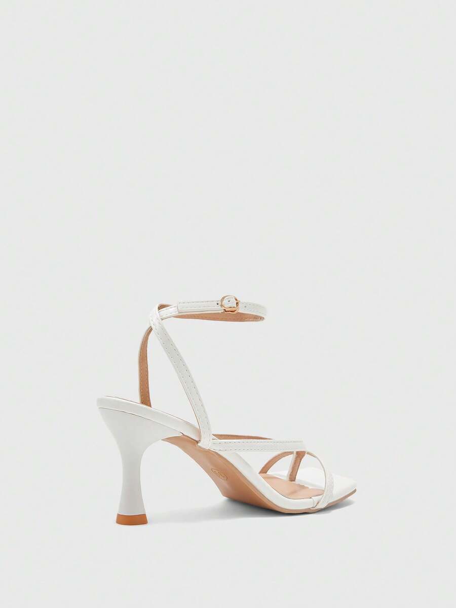 Burgundy women's thin strap thong sandals with ankle strap and kitten heels.