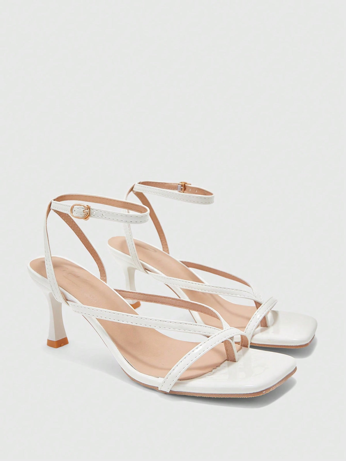 Burgundy women's thin strap thong sandals with ankle strap and kitten heels.