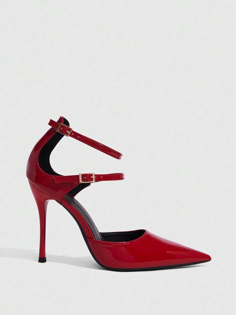 Red pointed toe stiletto high heels with ankle strap made of smooth PU leather for women.
