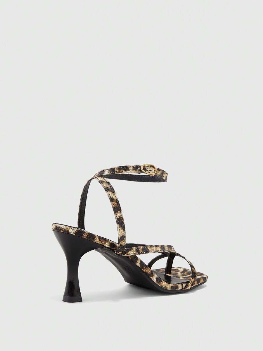 Burgundy women's thin strap thong sandals with ankle strap and kitten heels.
