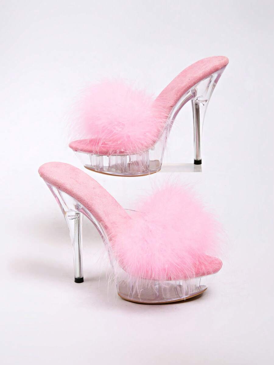 Transparent chunky heel platform slide sandals for women featuring clear PVC upper, open toe design, and ultra high heels.