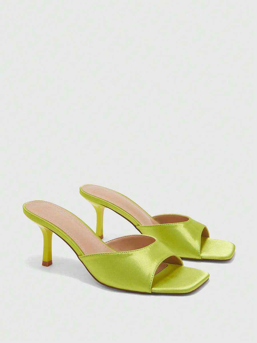 Women's black square toe high heel sandals featuring an open toe design, thin stiletto heel, and slingback strap.