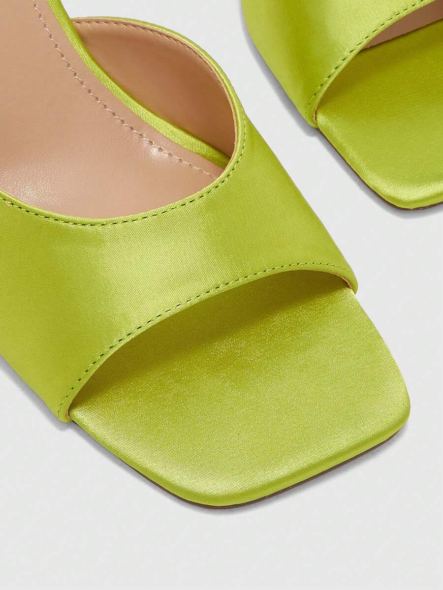 Women's black square toe high heel sandals featuring an open toe design, thin stiletto heel, and slingback strap.