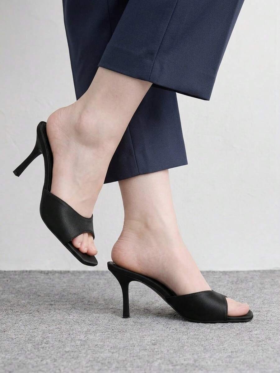 Women's black square toe high heel sandals featuring an open toe design, thin stiletto heel, and slingback strap.