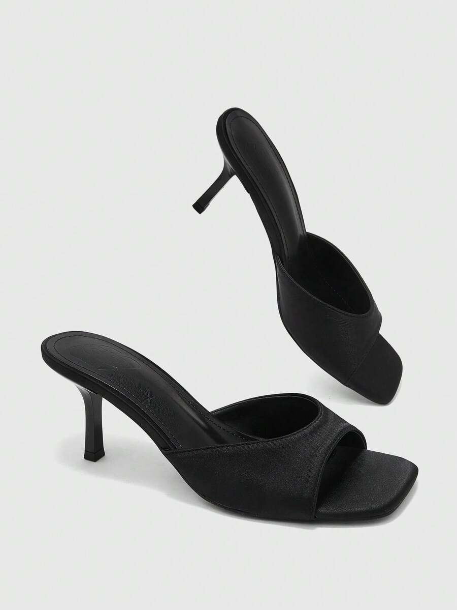 Women's black square toe high heel sandals featuring an open toe design, thin stiletto heel, and slingback strap.