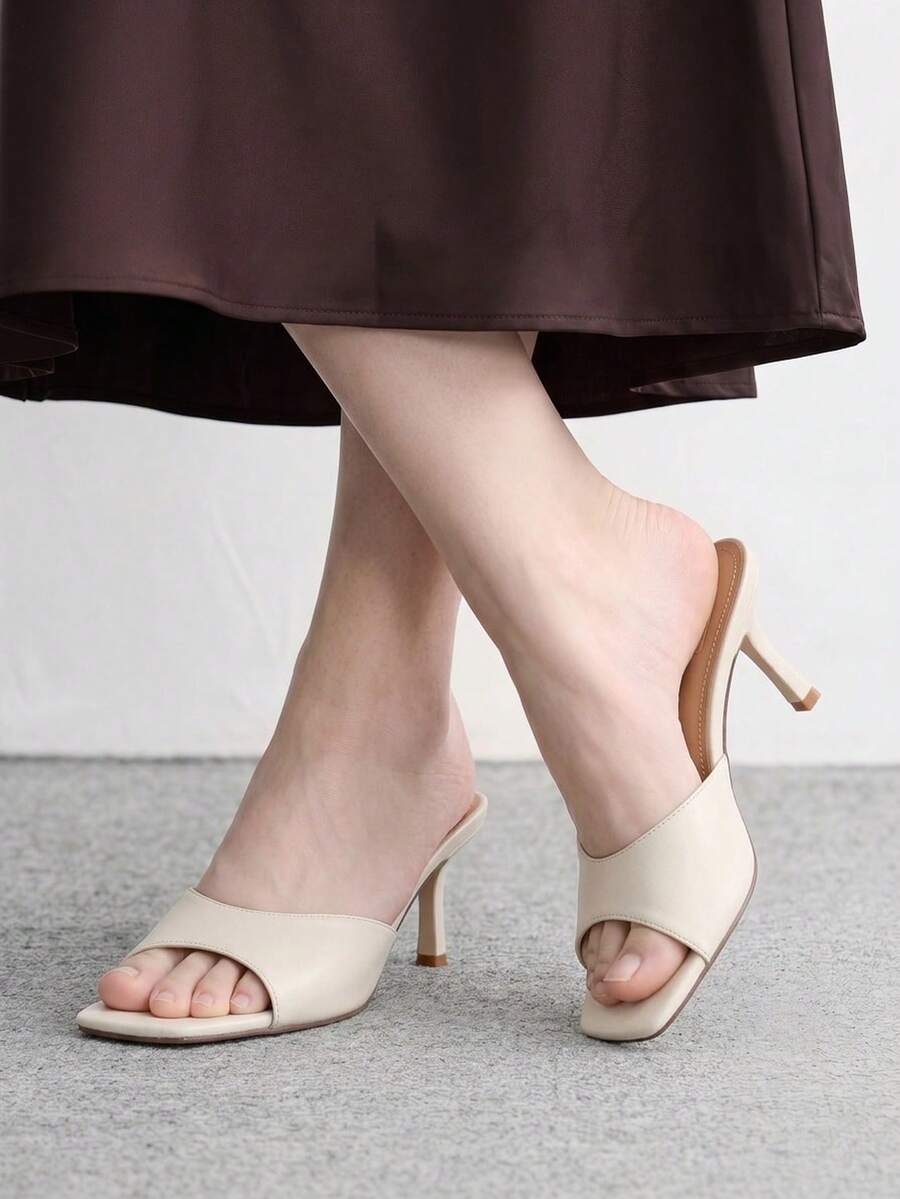 Women's black square toe high heel sandals featuring an open toe design, thin stiletto heel, and slingback strap.