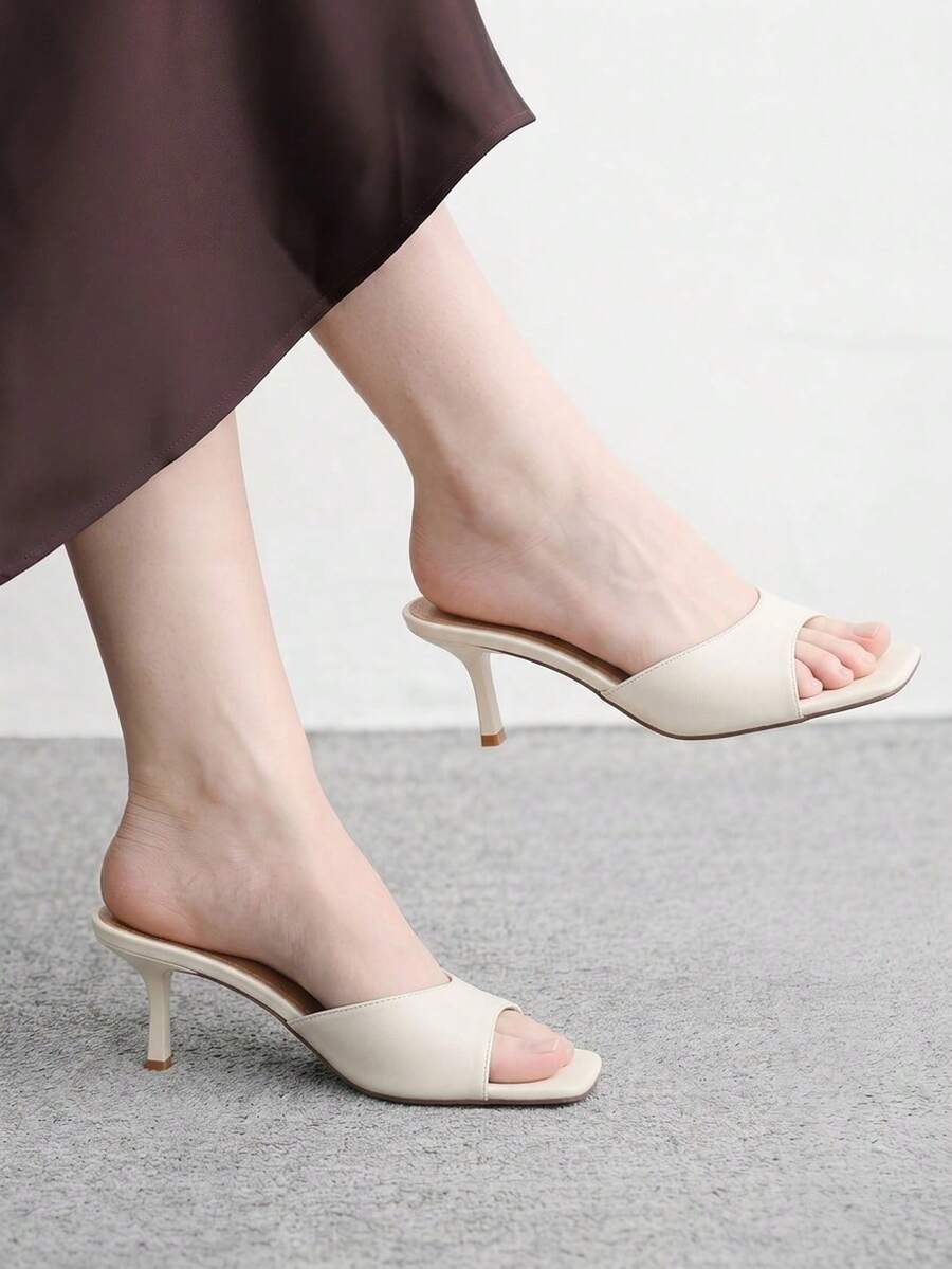 Women's black square toe high heel sandals featuring an open toe design, thin stiletto heel, and slingback strap.