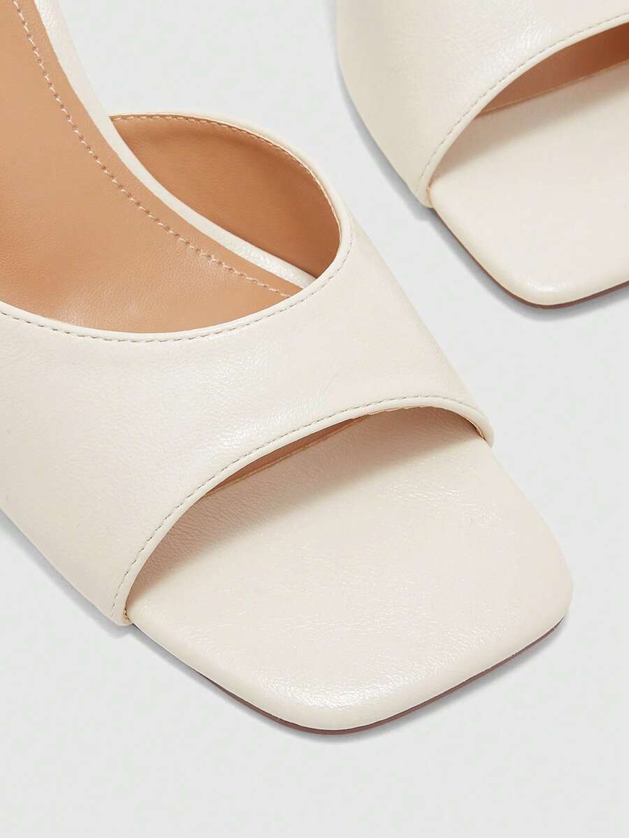 Women's black square toe high heel sandals featuring an open toe design, thin stiletto heel, and slingback strap.