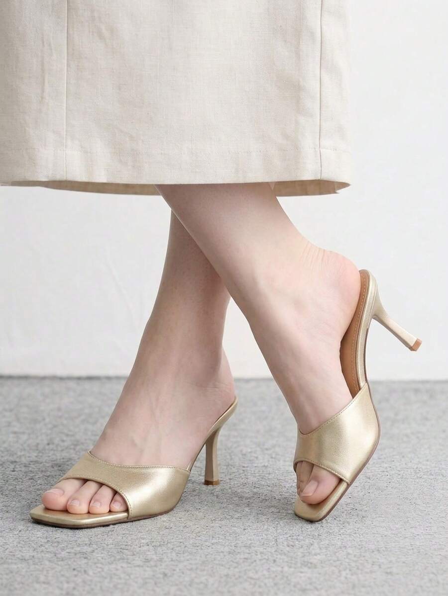 Women's black square toe high heel sandals featuring an open toe design, thin stiletto heel, and slingback strap.