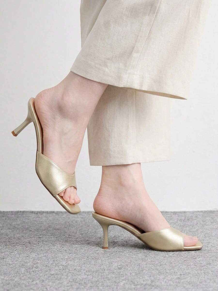 Women's black square toe high heel sandals featuring an open toe design, thin stiletto heel, and slingback strap.