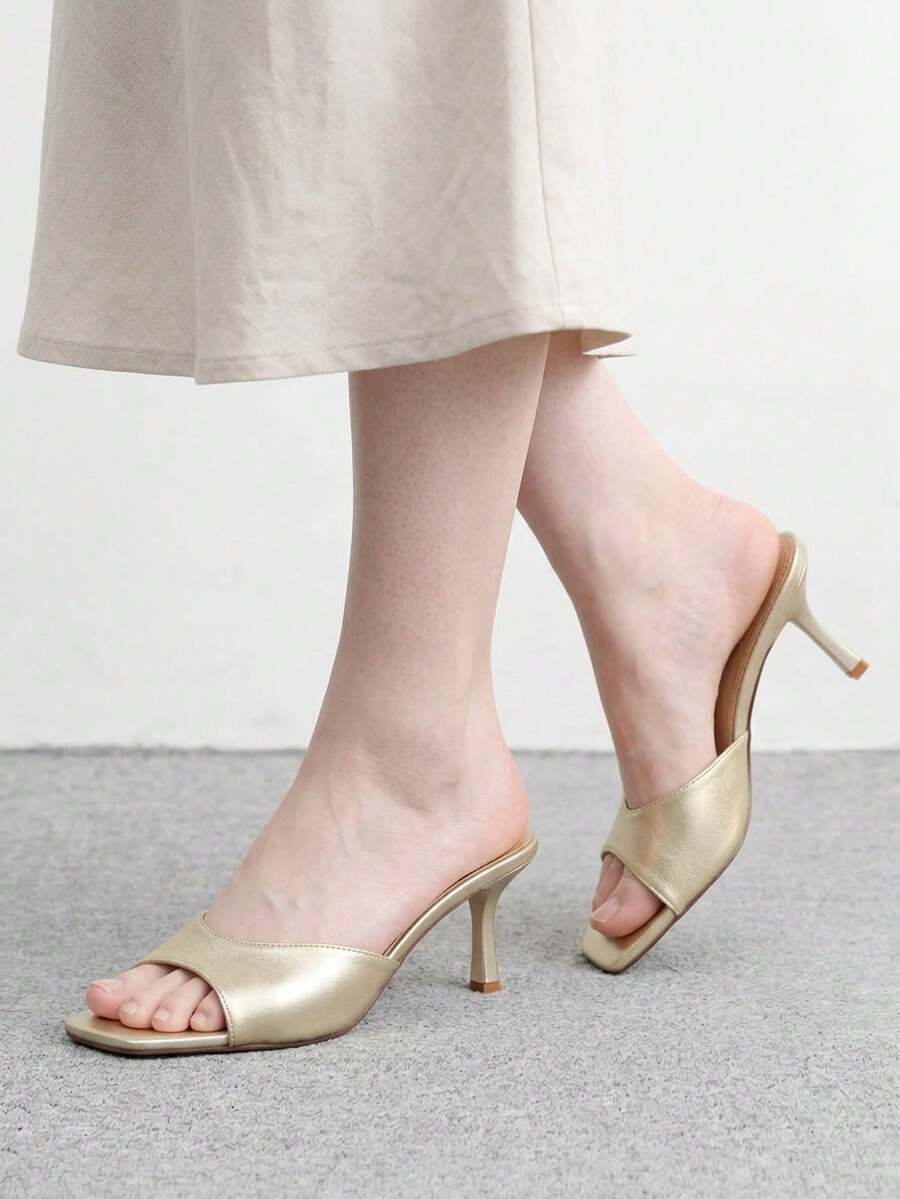 Women's black square toe high heel sandals featuring an open toe design, thin stiletto heel, and slingback strap.