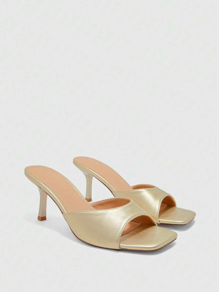 Women's black square toe high heel sandals featuring an open toe design, thin stiletto heel, and slingback strap.