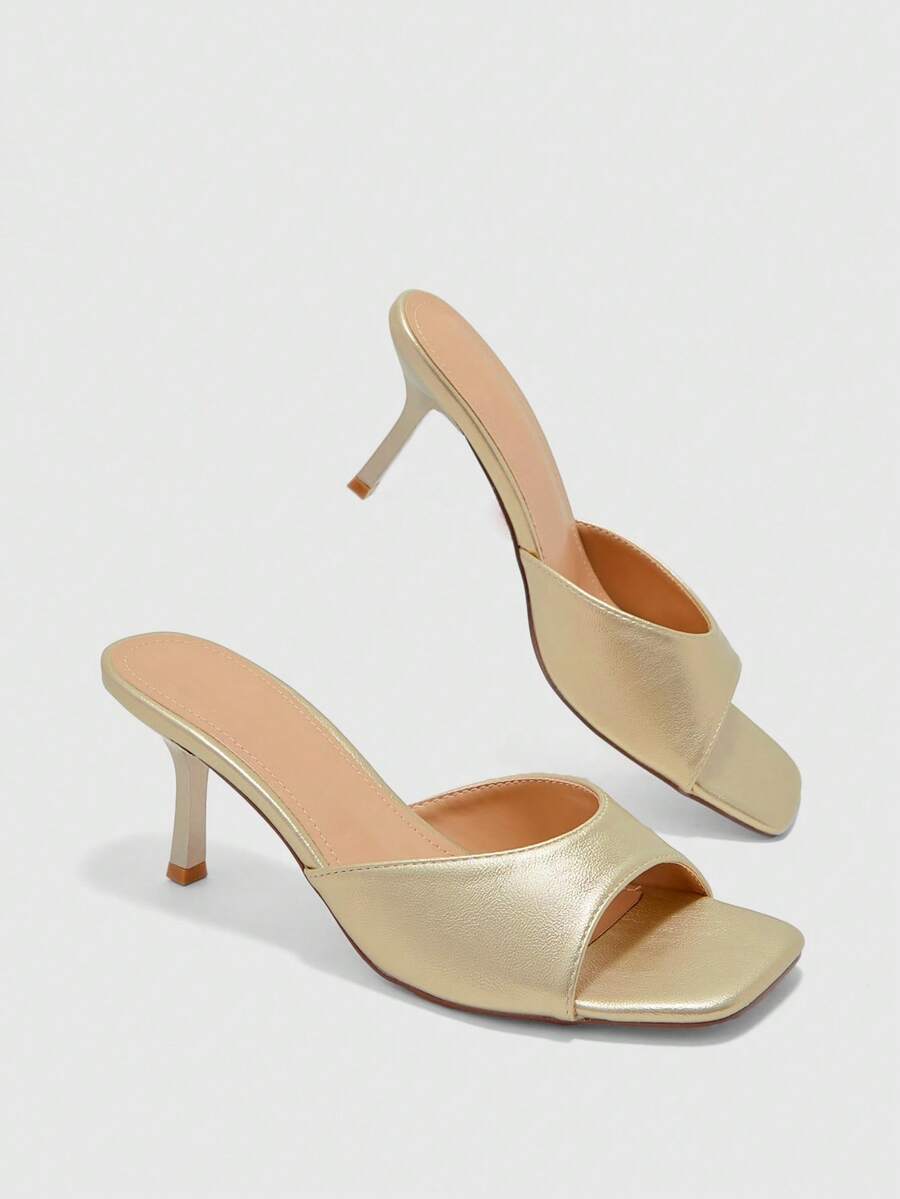 Women's black square toe high heel sandals featuring an open toe design, thin stiletto heel, and slingback strap.