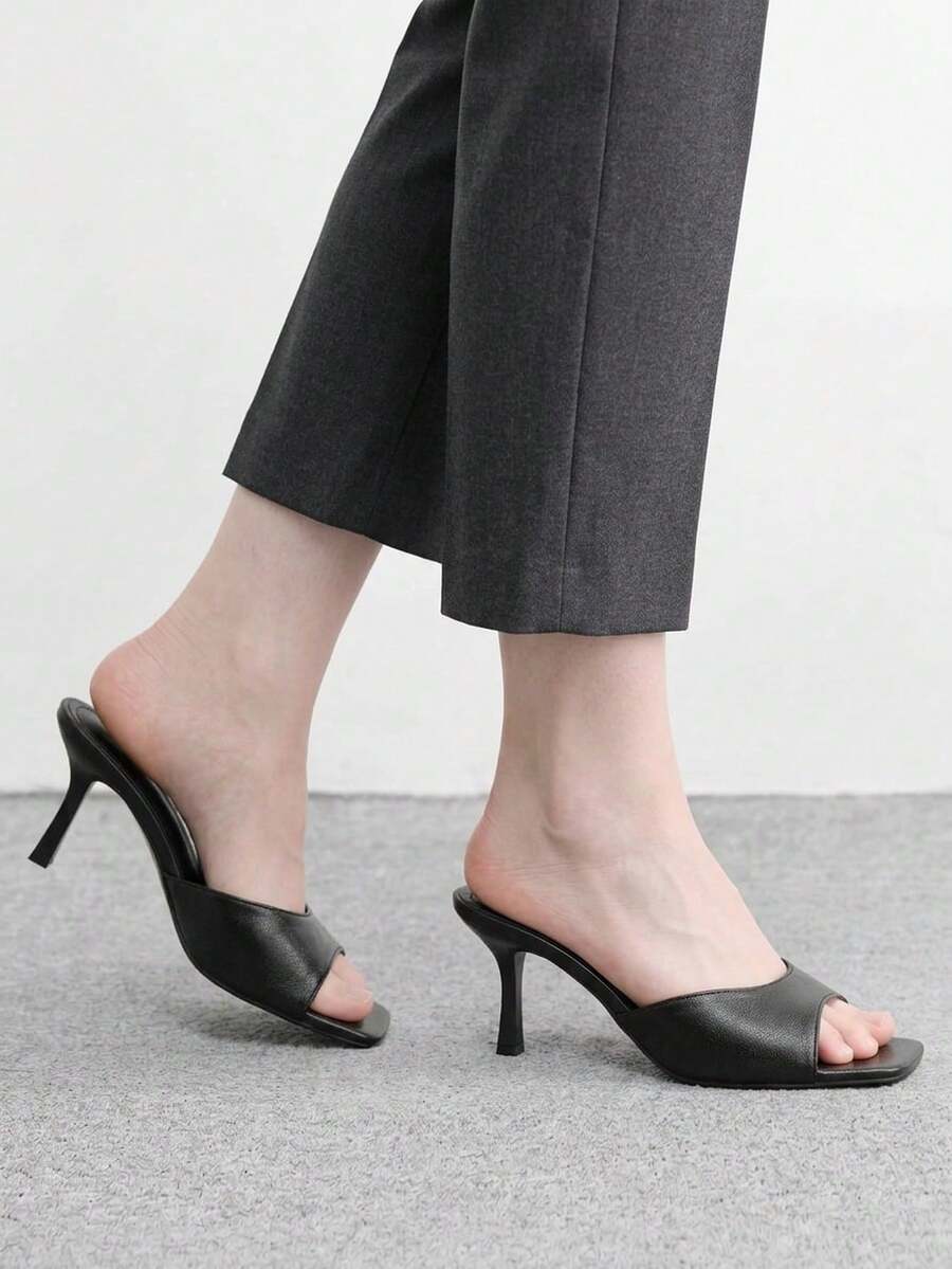 Women's black square toe high heel sandals featuring an open toe design, thin stiletto heel, and slingback strap.