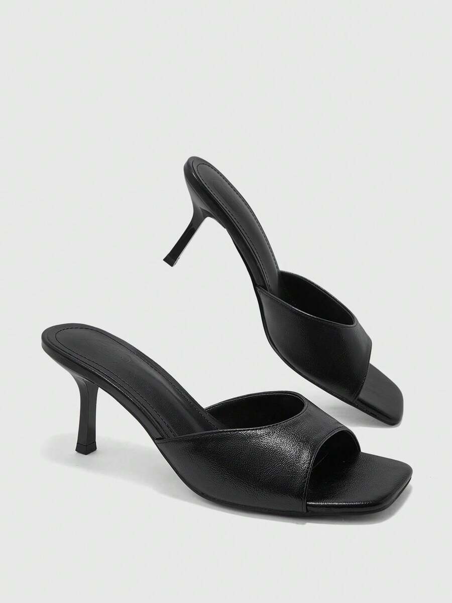 Women's black square toe high heel sandals featuring an open toe design, thin stiletto heel, and slingback strap.