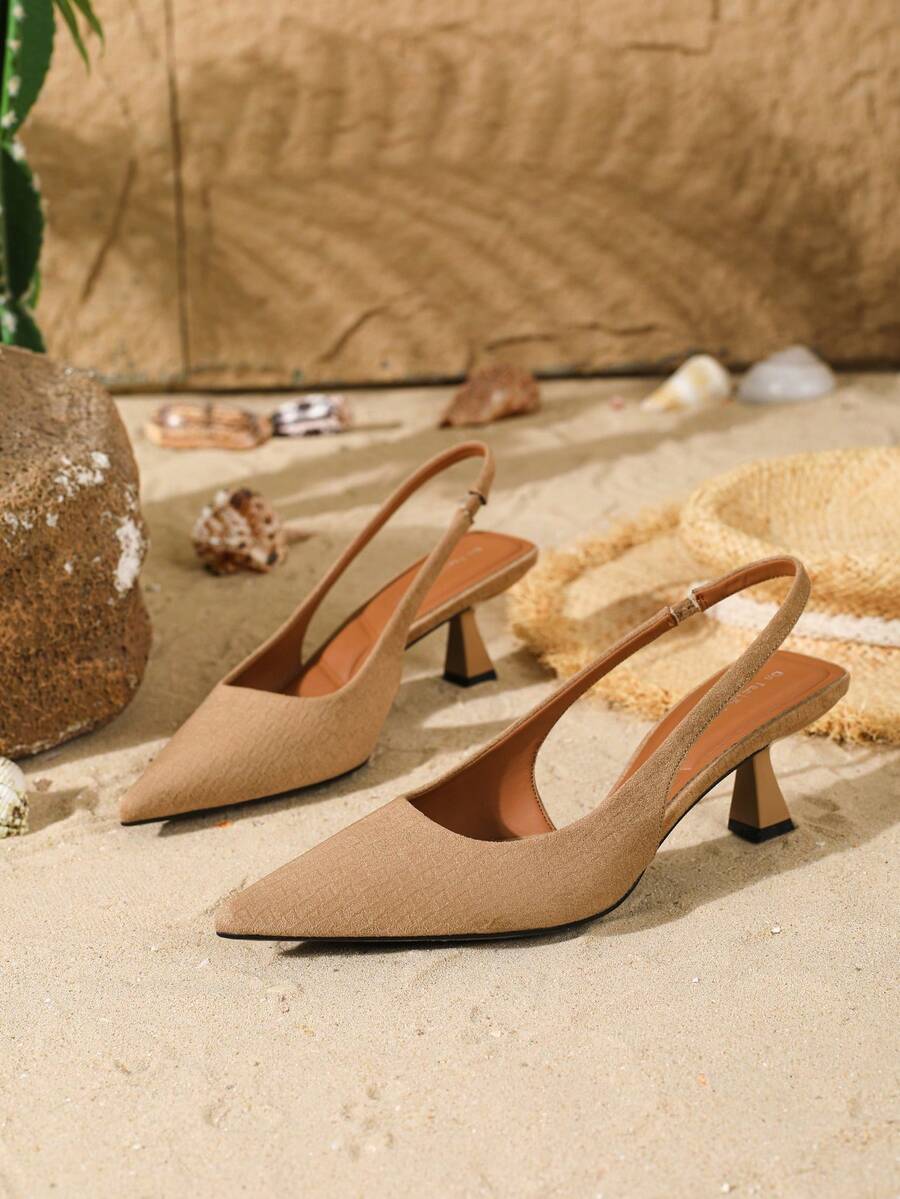 Women's elegant velvet kitten heel slingback pumps featuring a pointed closed toe and slip-on strap design.
