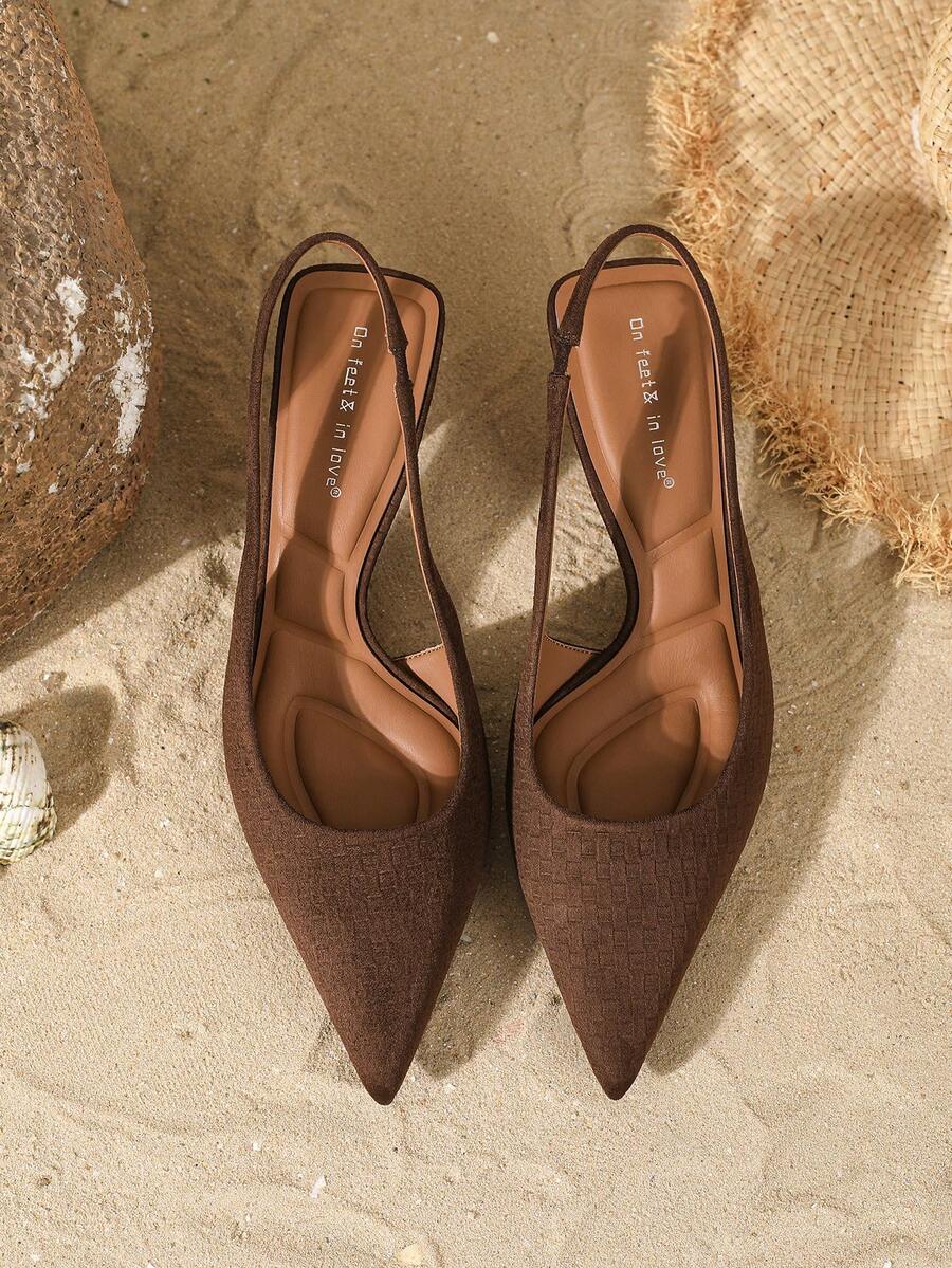 Women's elegant velvet kitten heel slingback pumps featuring a pointed closed toe and slip-on strap design.