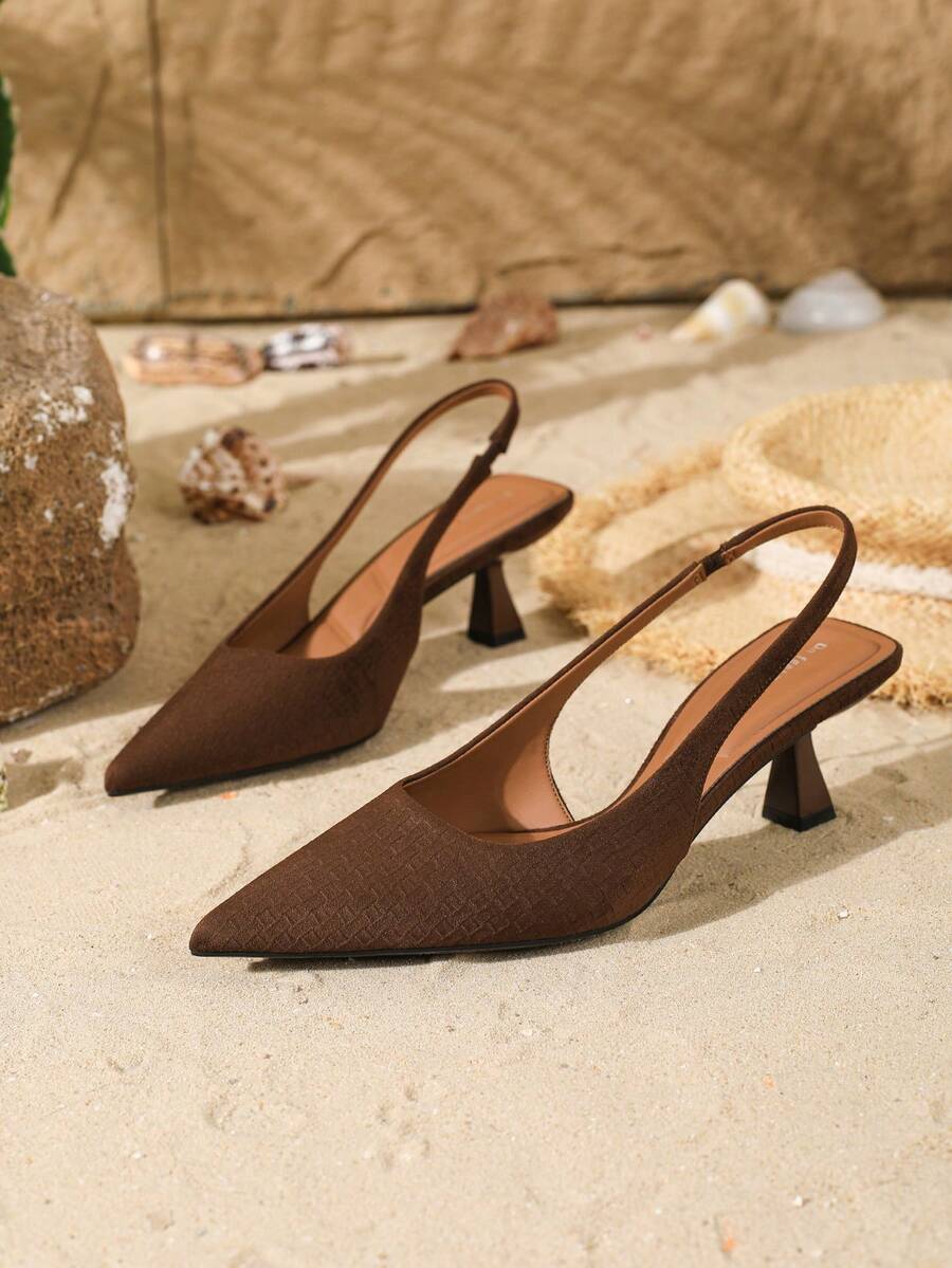 Women's elegant velvet kitten heel slingback pumps featuring a pointed closed toe and slip-on strap design.