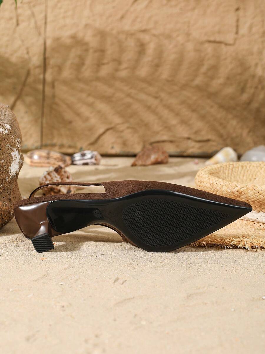 Women's elegant velvet kitten heel slingback pumps featuring a pointed closed toe and slip-on strap design.