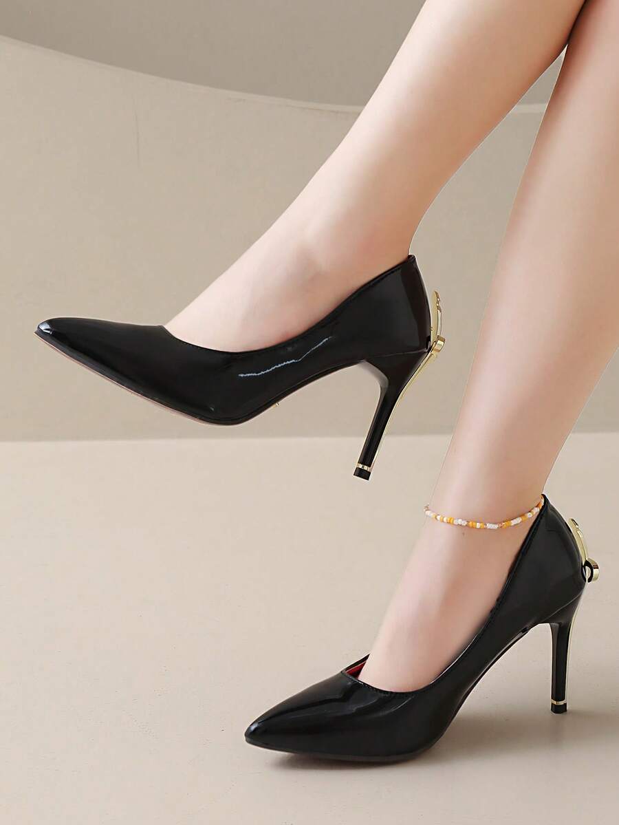 Glossy black pointed toe stiletto high heel pumps with bow detail for women