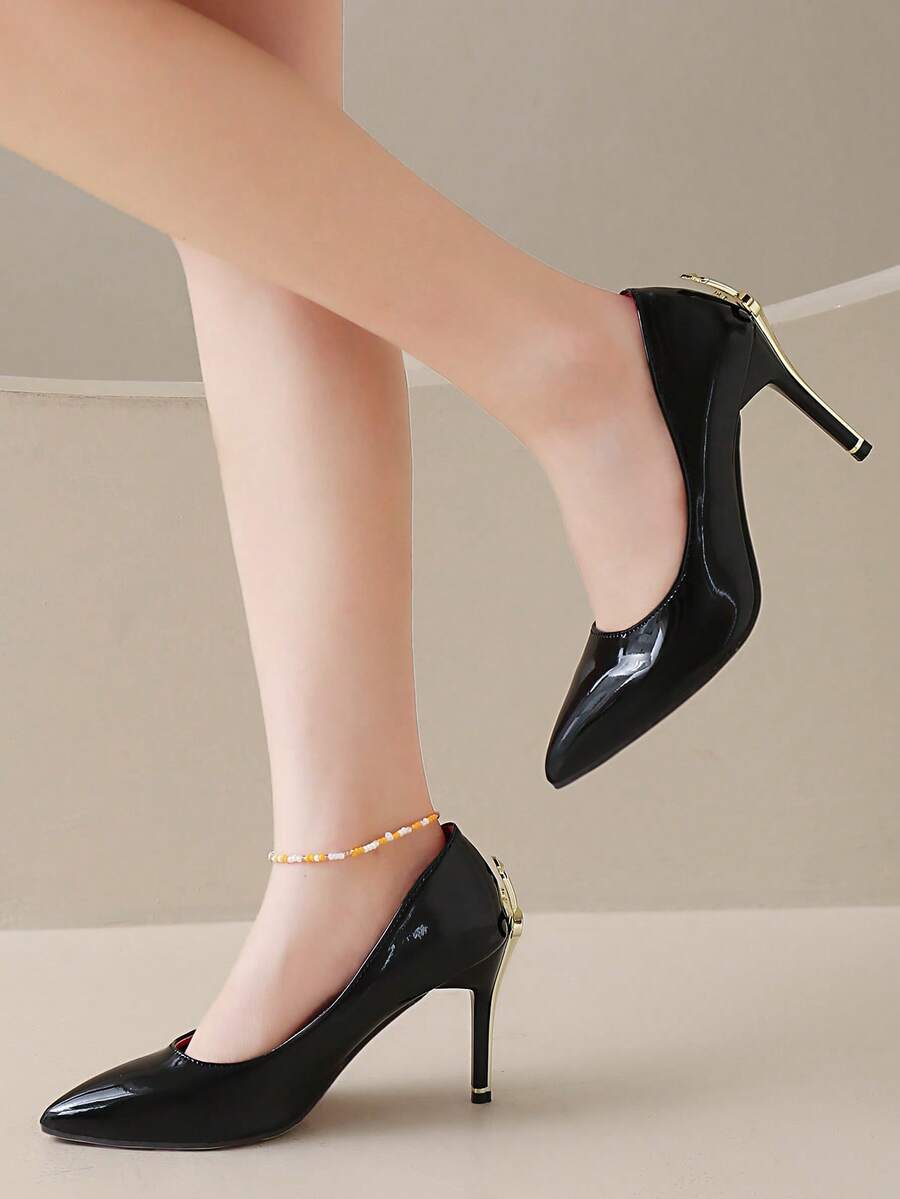 Glossy black pointed toe stiletto high heel pumps with bow detail for women