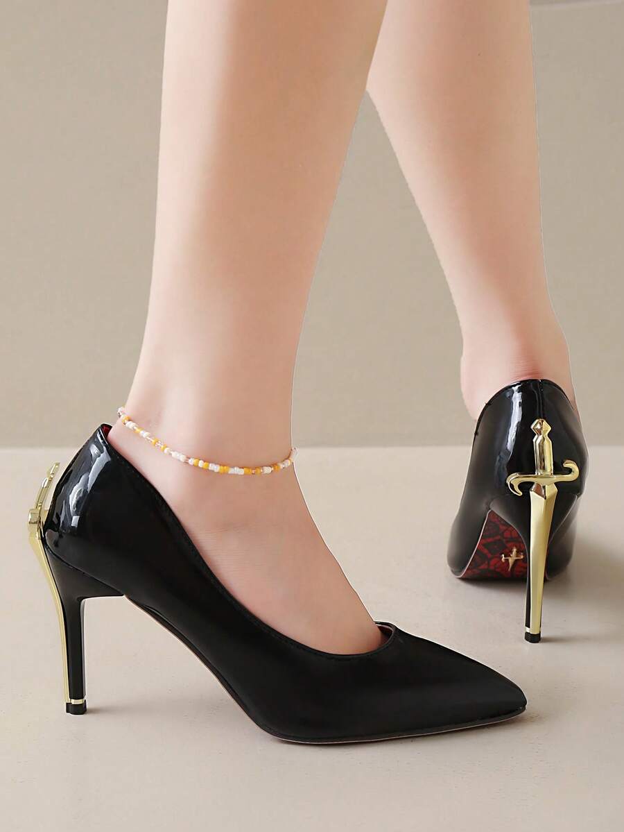 Glossy black pointed toe stiletto high heel pumps with bow detail for women