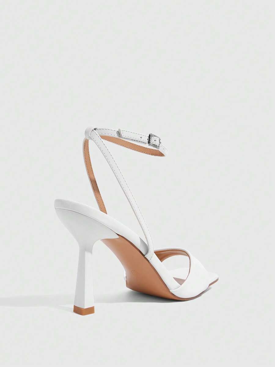 Women's open square toe stiletto high heel sandals featuring thin ankle straps and buckle closure.