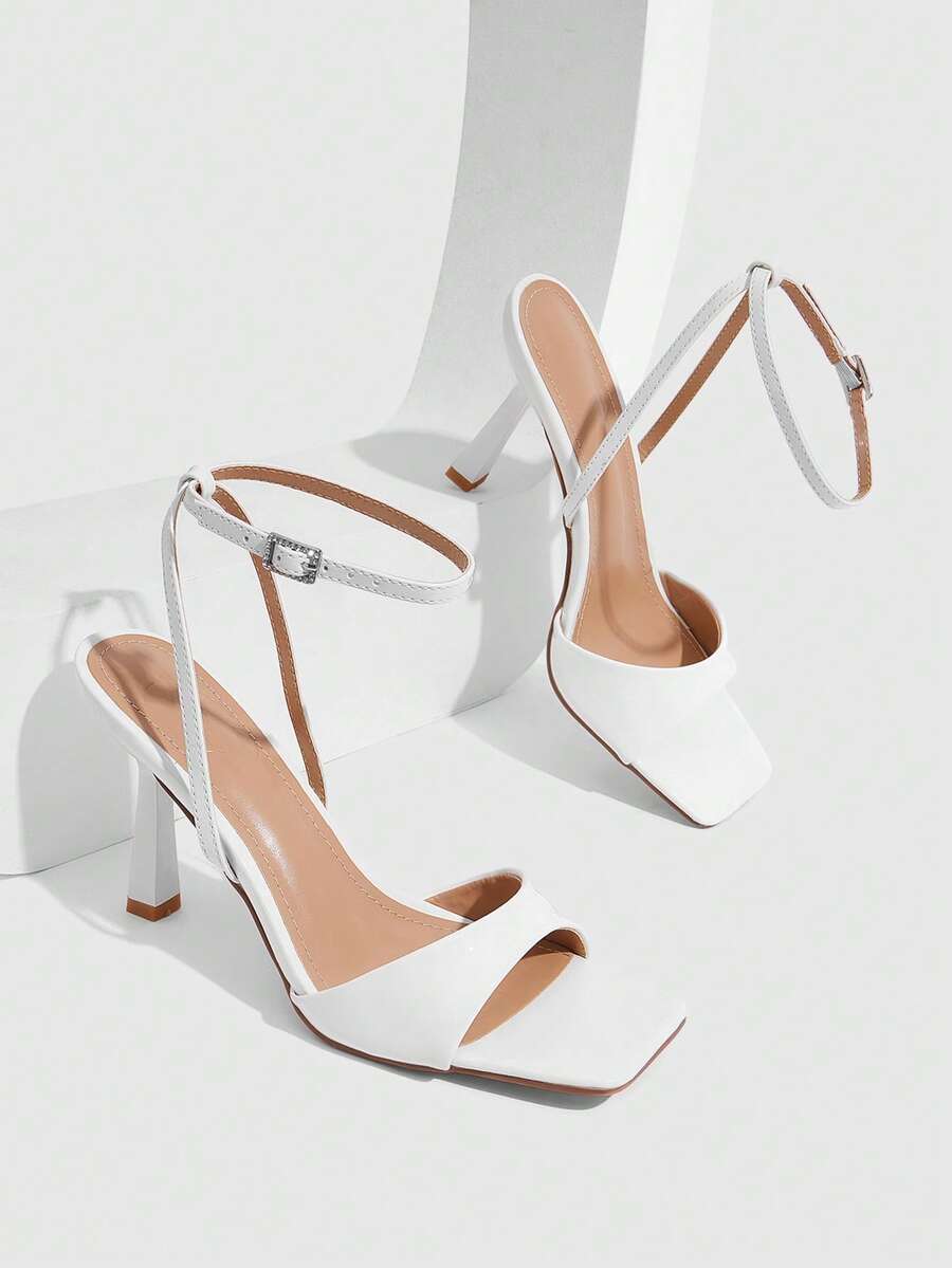 Women's open square toe stiletto high heel sandals featuring thin ankle straps and buckle closure.