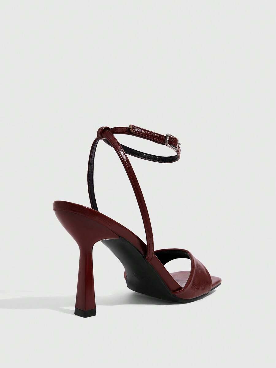 Women's open square toe stiletto high heel sandals featuring thin ankle straps and buckle closure.