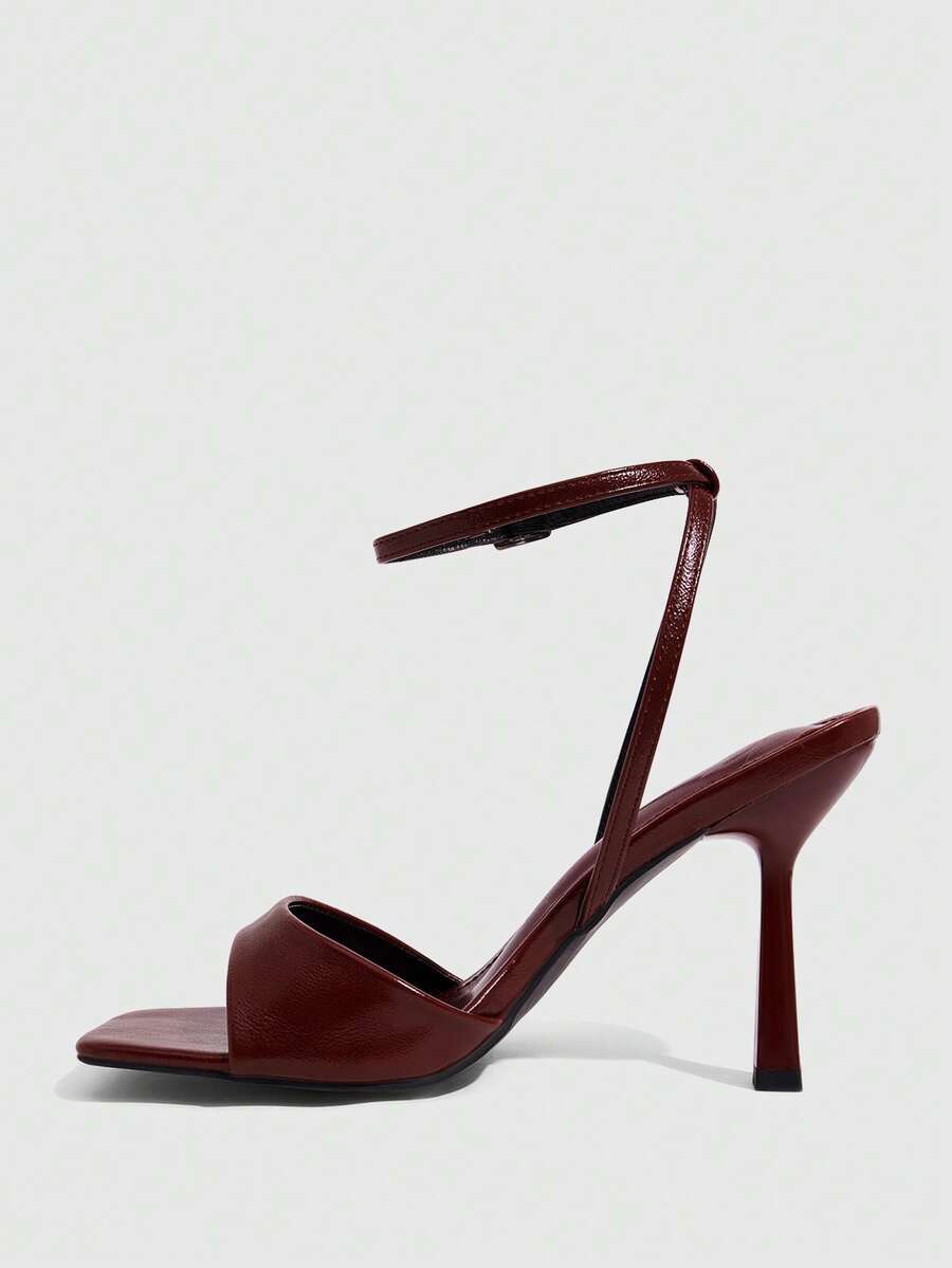 Women's open square toe stiletto high heel sandals featuring thin ankle straps and buckle closure.