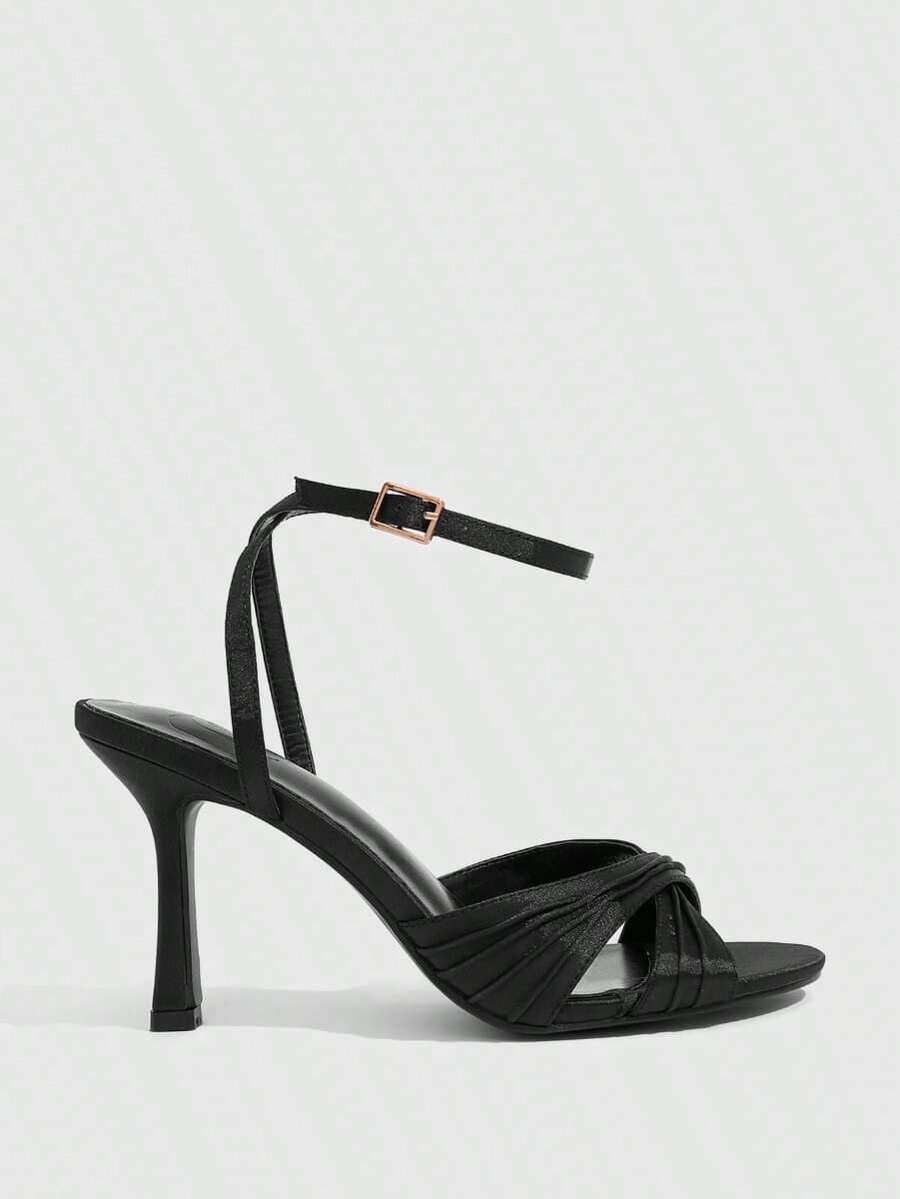 Women's high heel sandals featuring pleated strap detailing, an adjustable ankle strap with buckle closure, round open toe, and slim stiletto heel.